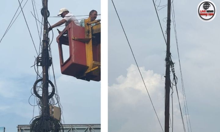 “हरिद्वार नगर निगम टीम स्ट्रीट लाइट पोल से अवैध केबल हटाते हुए”